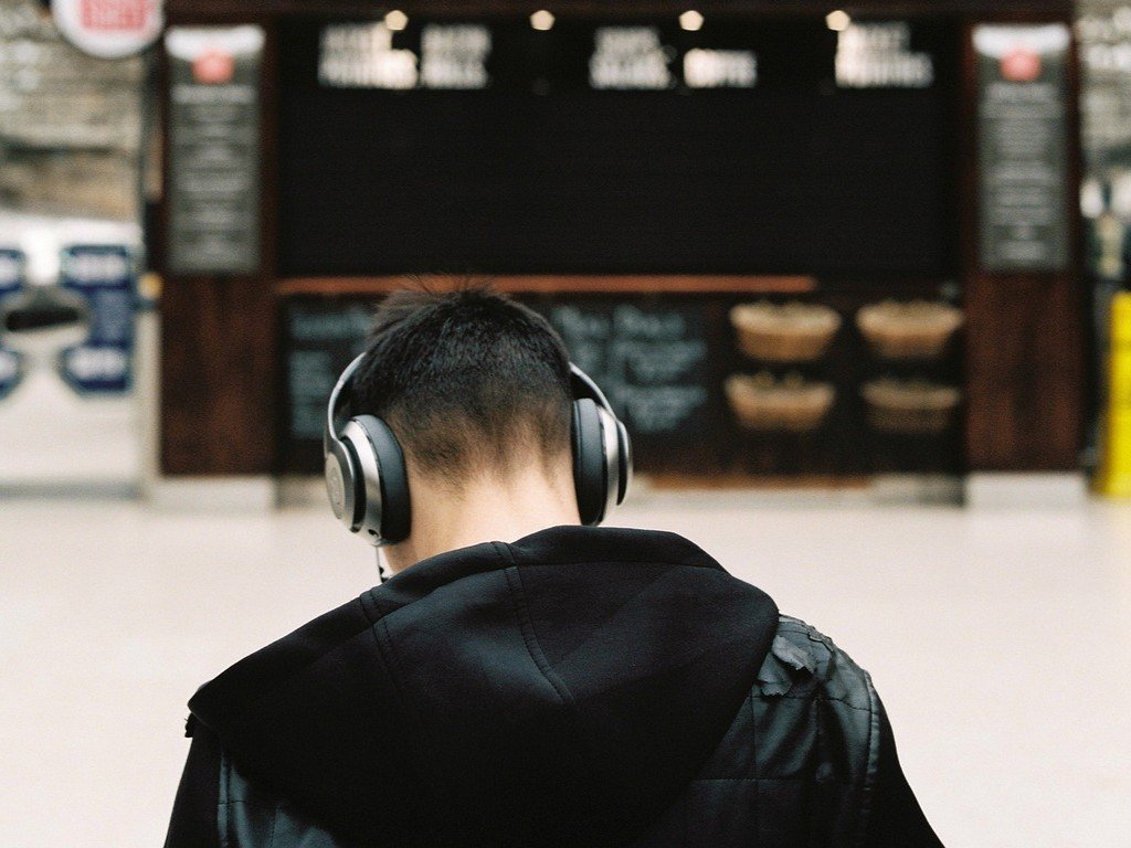 5. Ignoring Announcements with Headphones In (Image Credits: Pixabay)
