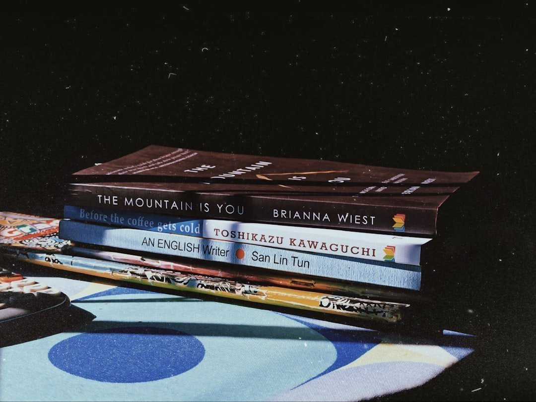 1. The Stack of Physical Books You'll "Definitely Read" (Image Credits: Unsplash)