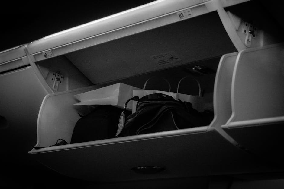 8. Cramming an Oversized Carry-On Into the Overhead Bin (Image Credits: Pexels)